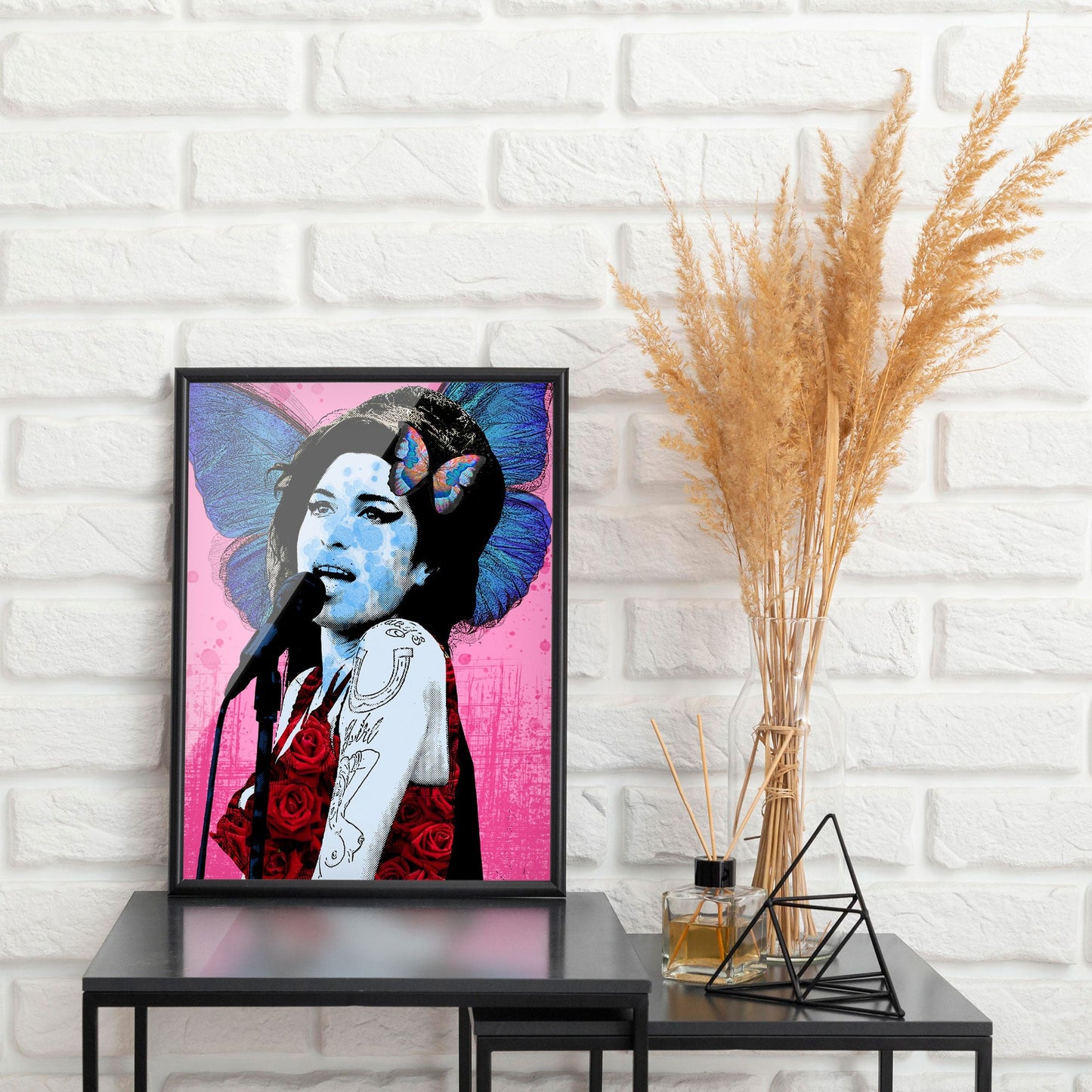 Amy Winehouse Pop Art Print in Frame against white brick wall